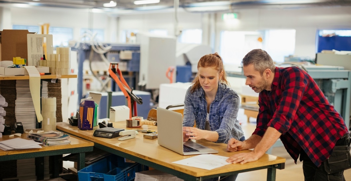 male with female apprentice in workshop